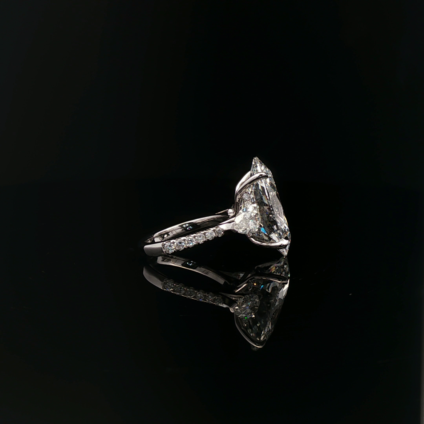 IGI Oval 10.08ct F VVS2 with pear side stone 18K/W