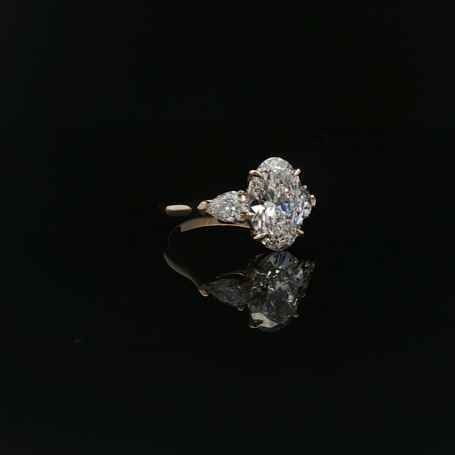 IGI Oval 3.07ct D VS1 18K/Y with 0.3ct pear each side