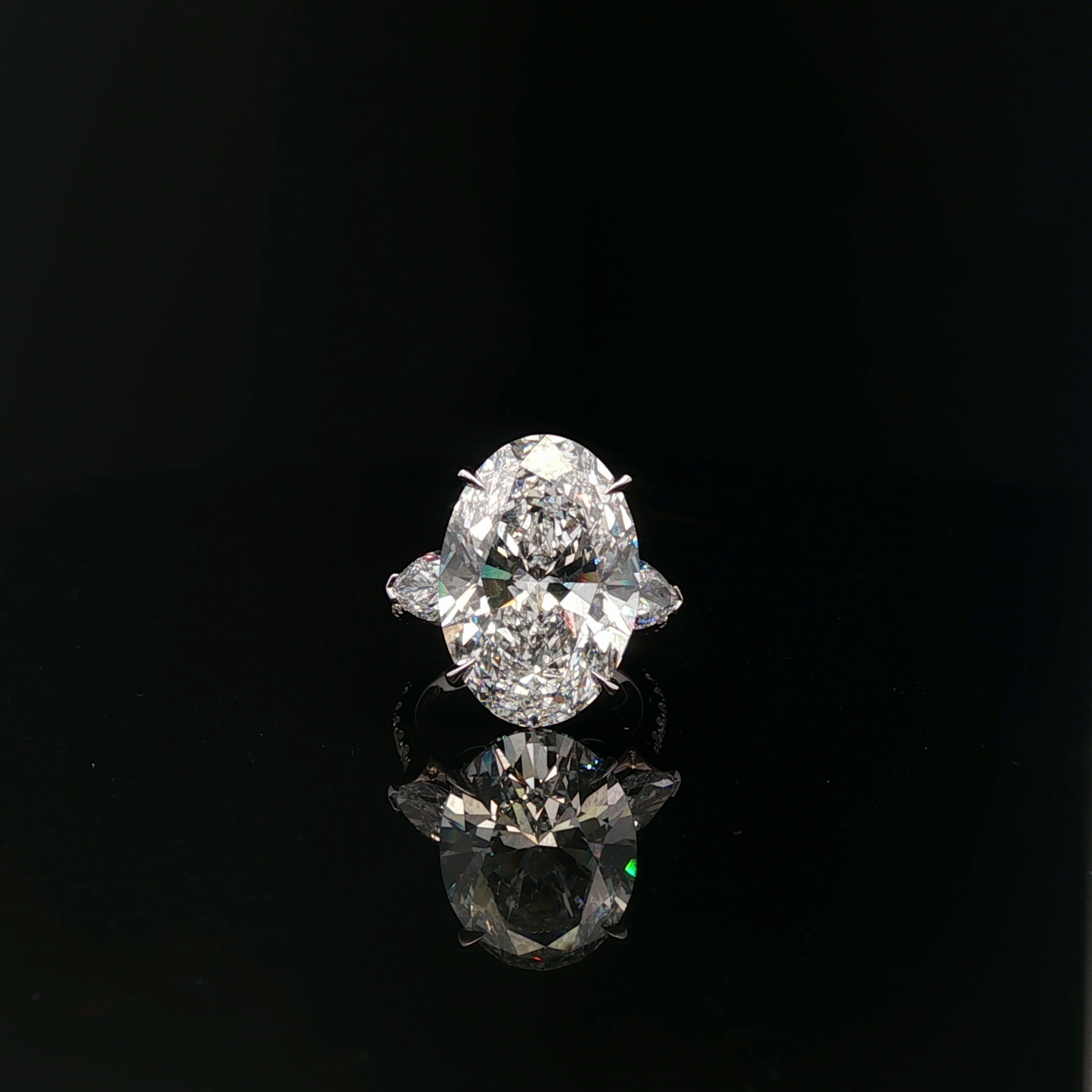 IGI Oval 10.08ct F VVS2 with pear side stone 18K/W