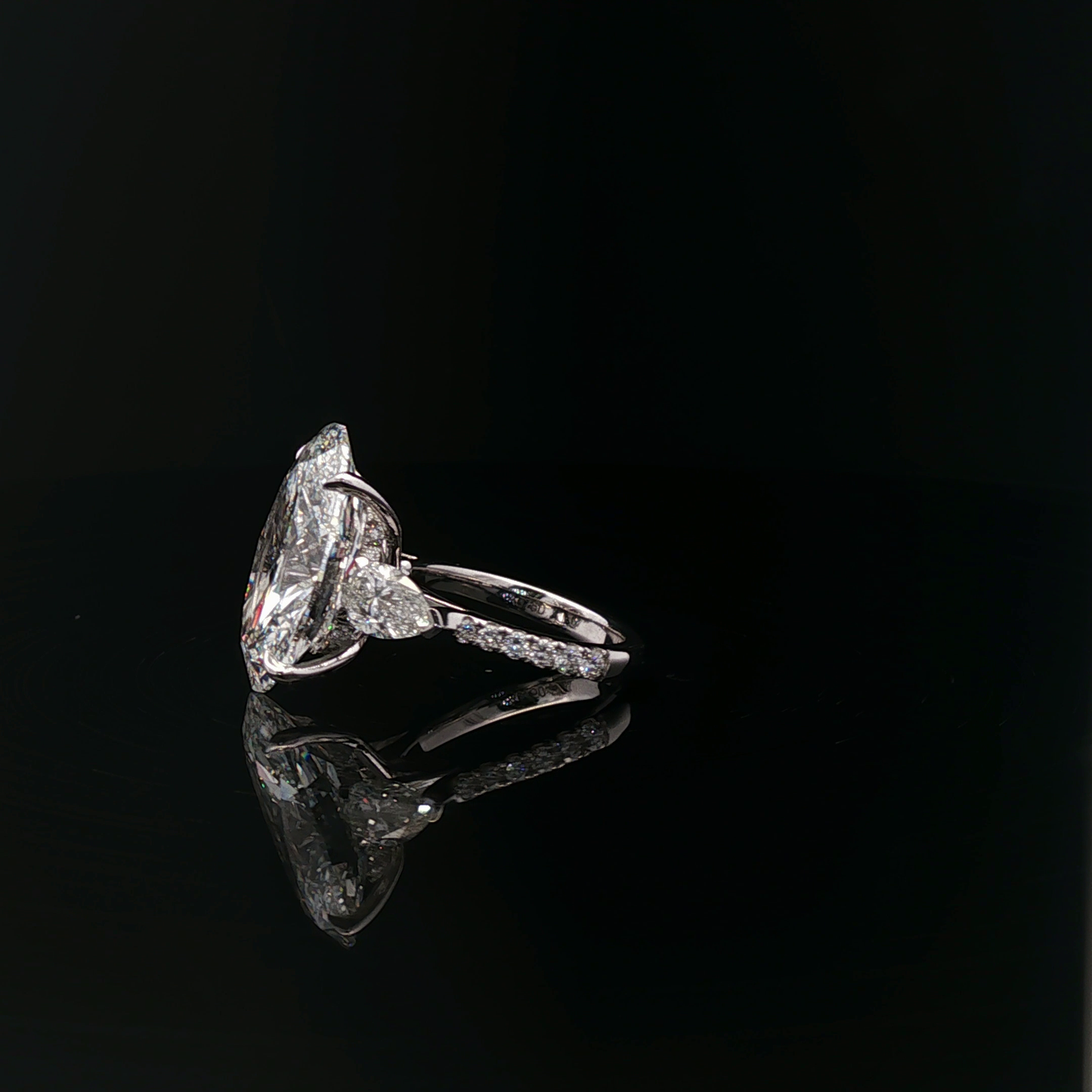 IGI Oval 10.08ct F VVS2 with pear side stone 18K/W