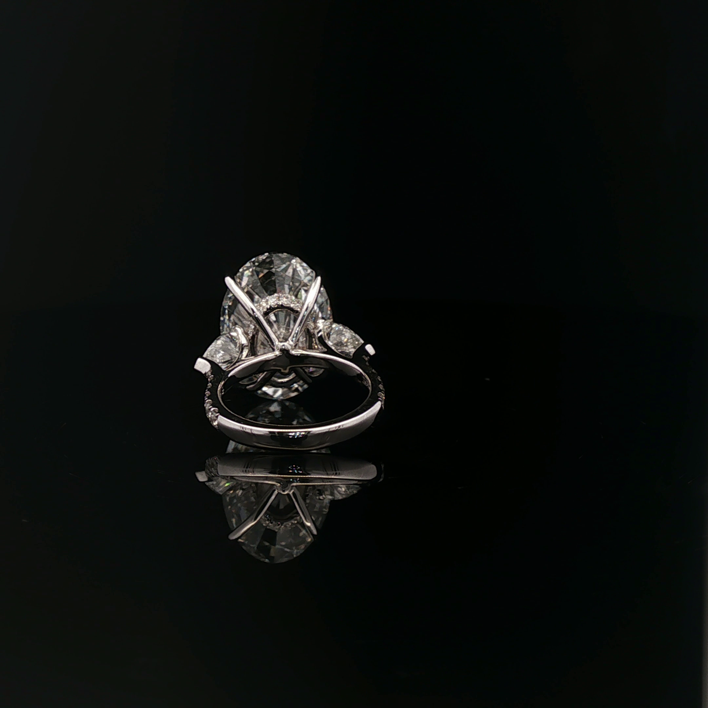 IGI Oval 10.08ct F VVS2 with pear side stone 18K/W
