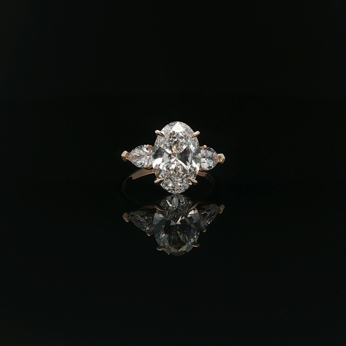 IGI Oval 3.07ct D VS1 18K/Y with 0.3ct pear each side