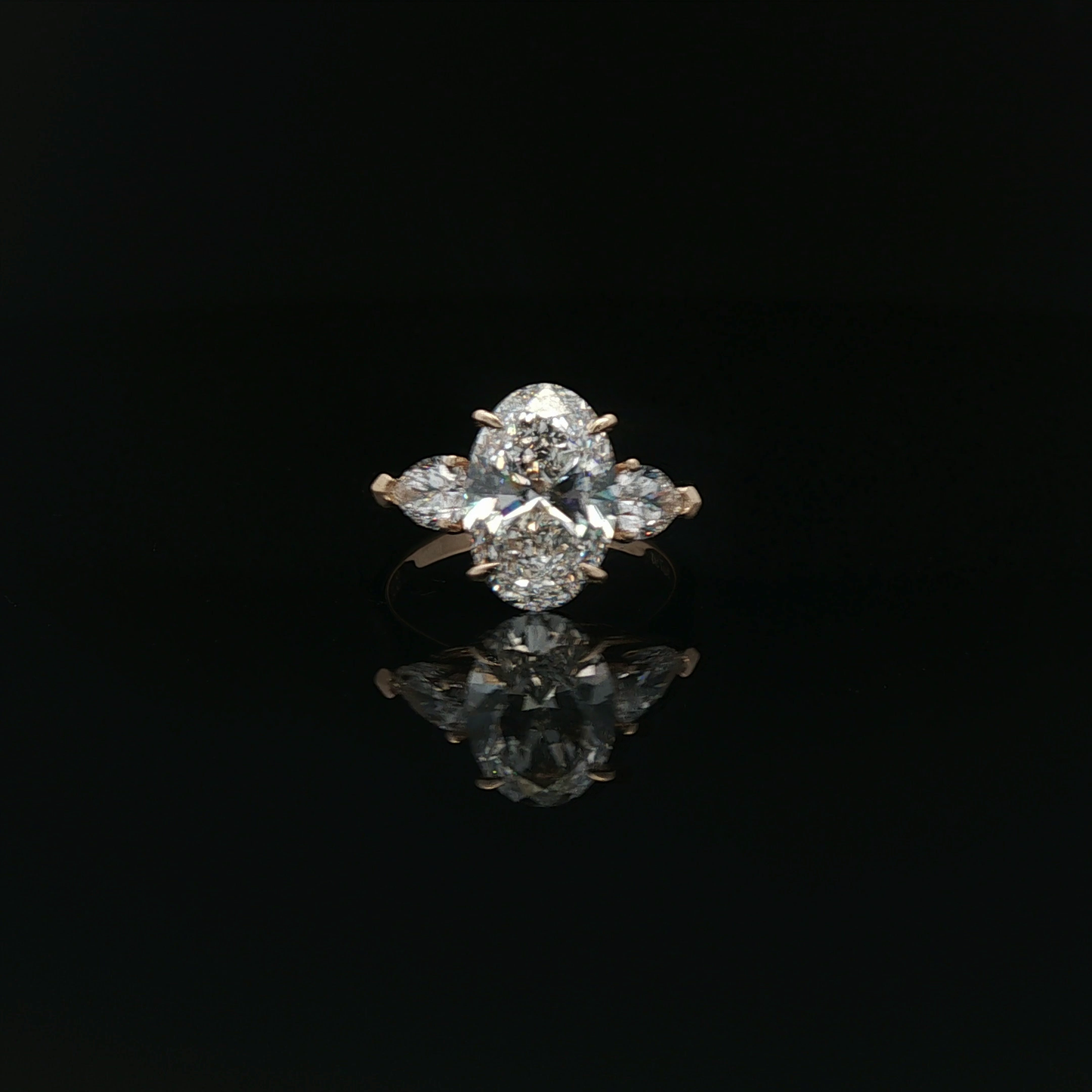 IGI Oval 3.07ct D VS1 18K/Y with 0.3ct pear each side