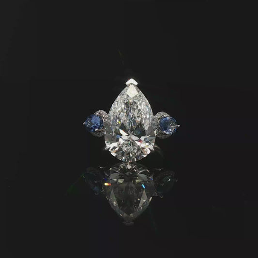 Pear 8.88ct E VVS2 with oval shape sapphire 18k/W