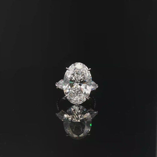 IGI Oval 10.08ct F VVS2 with pear side stone 18K/W